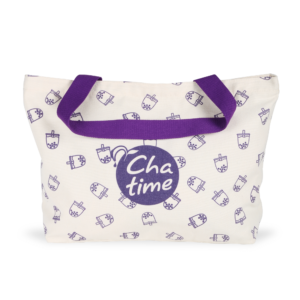 off-white canvas material tote bag with purple handle, bubble tea design all over and a purple Chatime logo in the middle of the bag